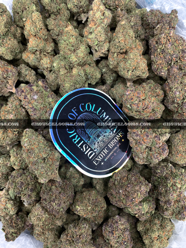 Close-up of Pink Guava strain featuring forest green buds with pink undertones, pink-orange hairs, and golden-amber trichomes, available for weed delivery in Virginia and Washington, DC. Known for its tropical guava flavor and euphoric hybrid effects.