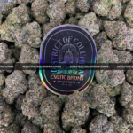 Hawaiian Breeze cannabis flower with dense mint green buds, amber trichomes, and tropical aroma