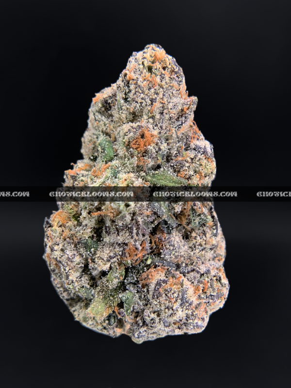 Hawaiian Breeze cannabis flower with dense mint green buds, amber trichomes, and tropical aroma