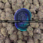 Lemonhead OG strain with zesty lemon aroma, golden trichomes, and sativa-dominant effects, available for cannabis delivery in DC and Virginia.