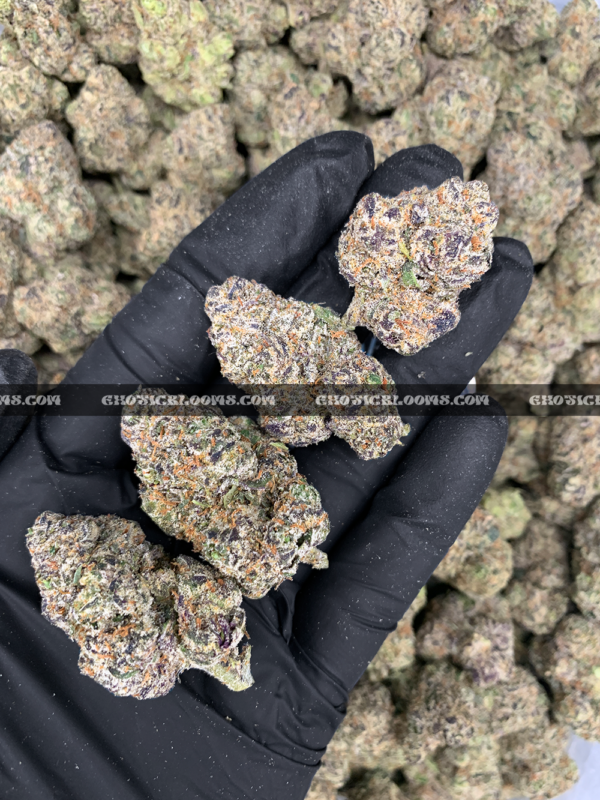 Lemonhead OG strain with zesty lemon aroma, golden trichomes, and sativa-dominant effects, available for cannabis delivery in DC and Virginia.