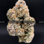 Lemonhead OG strain with zesty lemon aroma, golden trichomes, and sativa-dominant effects, available for cannabis delivery in DC and Virginia.