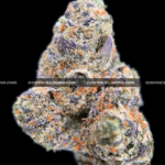 Lemonhead OG strain with zesty lemon aroma, golden trichomes, and sativa-dominant effects, available for cannabis delivery in DC and Virginia.