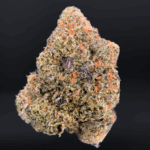 Dry Ice strain dense olive-green buds with pink-tinted trichomes, delivering 25–26% THC. Available for cannabis delivery in Washington DC, Virginia, Maryland, and Richmond.