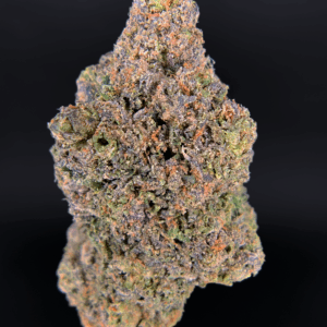 Pink Monet hybrid cannabis strain with 26–30% THC, sweet cherry aroma, purple-green buds, and uplifting yet relaxing effects, available for weed delivery in Washington DC, Northern Virginia, Richmond, and Maryland via Exotic Blooms.