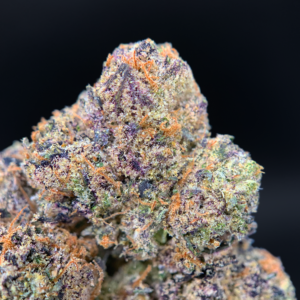 Purple Pop Rocks indica dominant cannabis strain with purple frosty buds available at Exotic Blooms Washington DC weed delivery