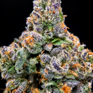 Slusherz indica-leaning hybrid flower with dense purple-green buds and frosty trichomes available for DC and Virginia weed delivery